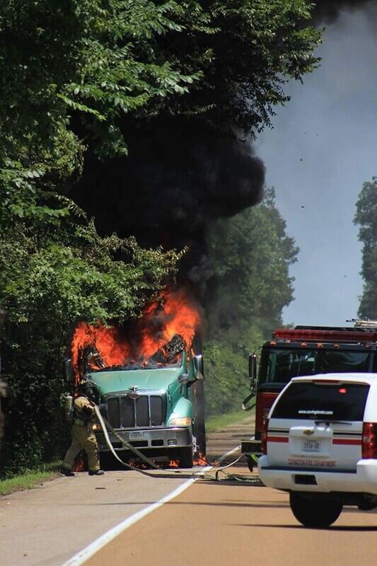 covington fire department responding to a dump truck on fire
