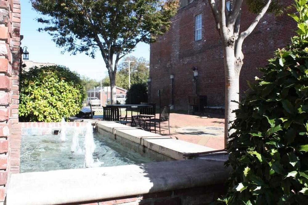 a memorial fountain at the park on the square