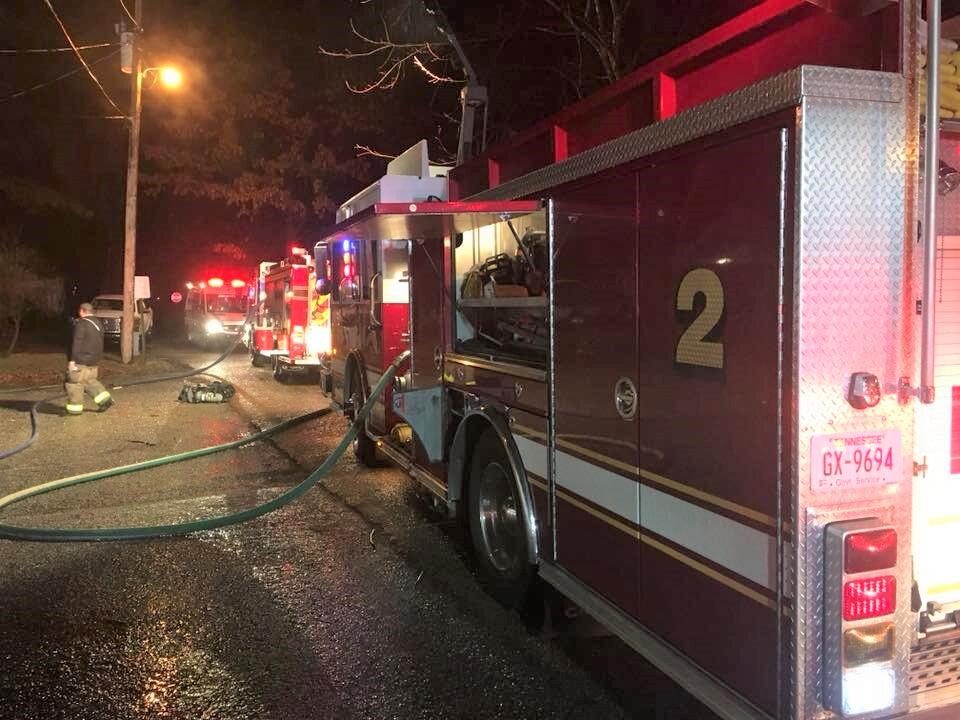 Covington fire trucks lined up at night responding to a fire