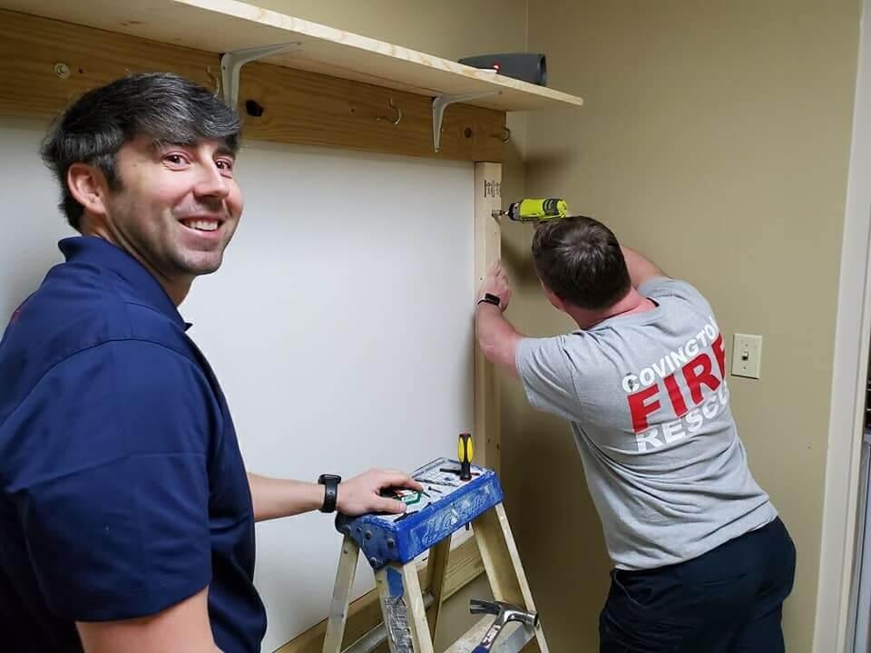 covington fire department members doing carpentry work