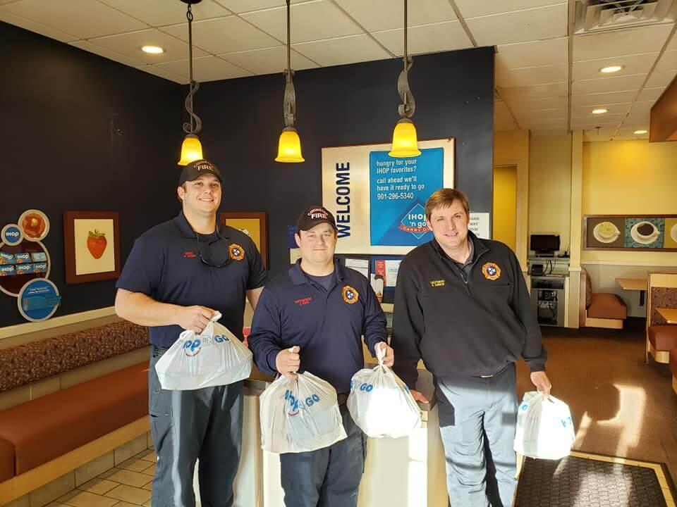covington fire department members getting food to go