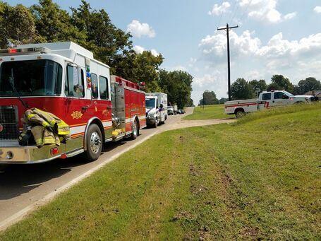 covington fire department vehicles lining a highway