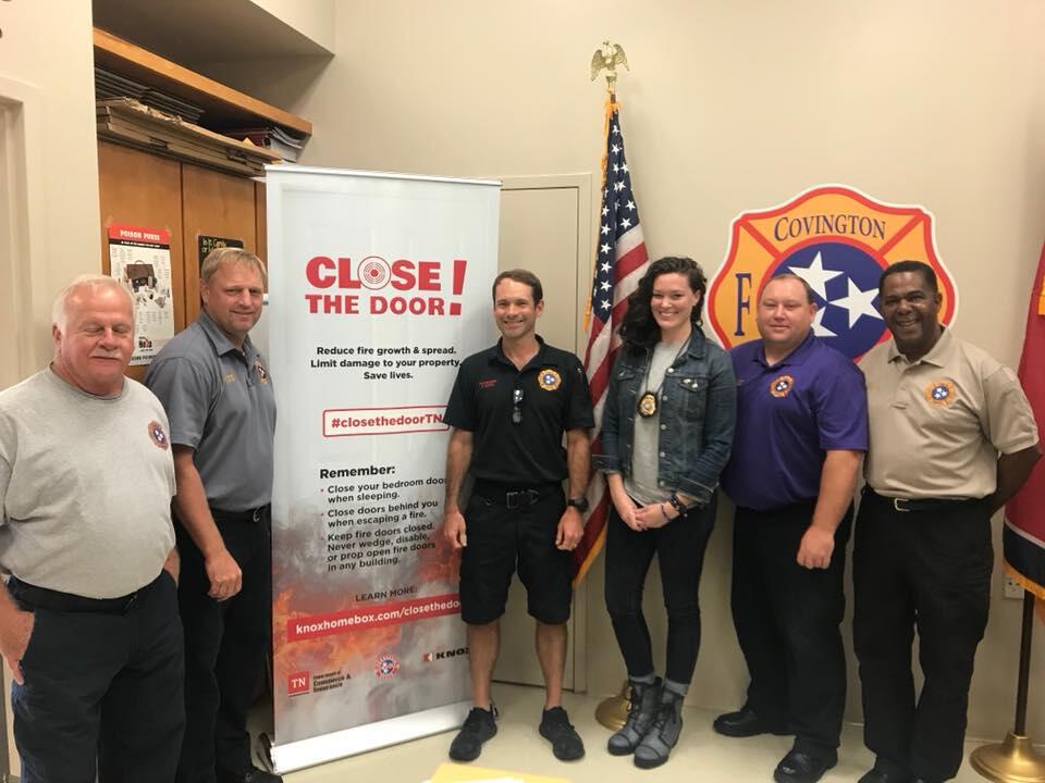 covington fire department members posing for a photo