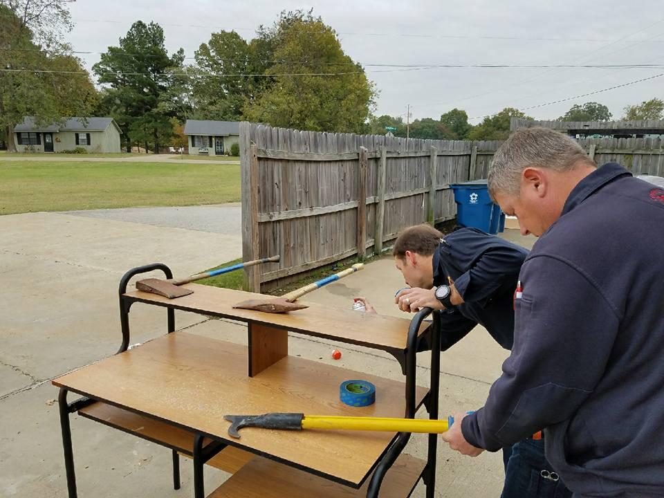 covington fire department preparing axes for a demonstration