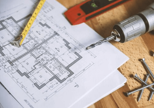 blueprints and carpentry tools
