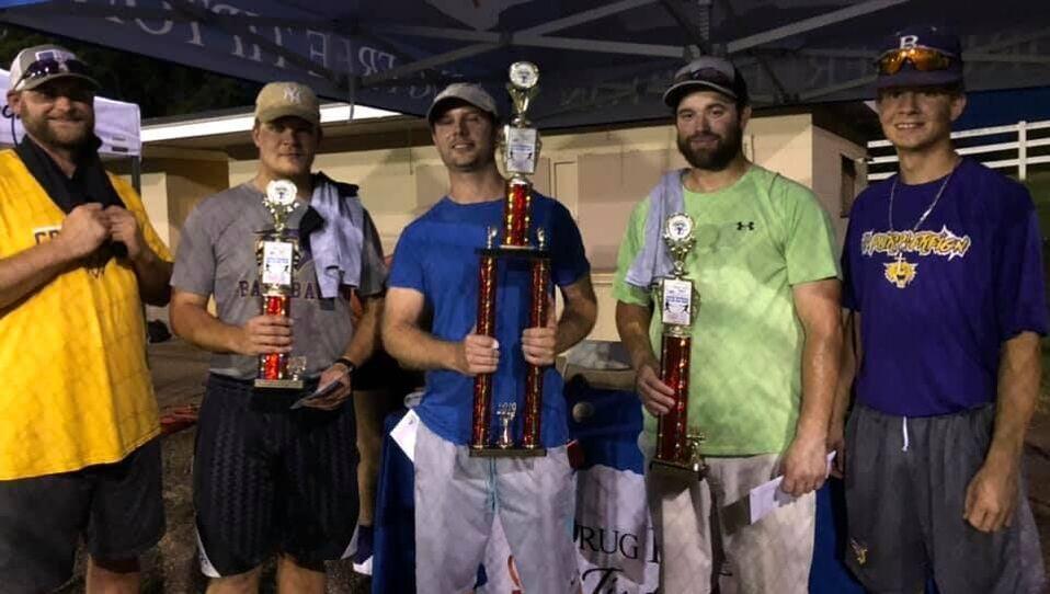 five men who just finished playing softball