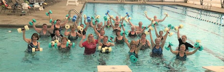a group of water aerobics participants in a pool