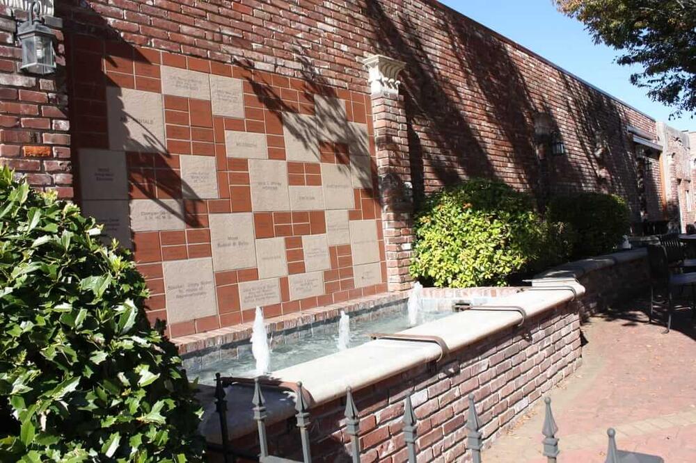 a memorial fountain at the park on the square